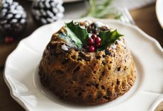 Close up of a Christmas pudding with holly on top